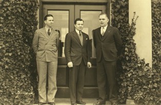 Tom Hulcher, Edward Sharp, and Frank Zaic (center) in front of NACA admin building, unknown date (Source #0018 History Program coll, NMAM Archives)