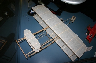 This scale Wright Flyer was built by museum volunteers from plans published by the Ideal Aeroplane & Supply Co. Inc. in 1911.  (Source: National Model Aviation Museum, Made for Museum, 2011.04.01.)