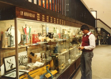 Someone investigates the contents of a museum display during the Reston Grand Opening Ceremony, September 24-25, 1983.  (Source: National Model Aviation Museum Archives, AMA Collection, #0001.)