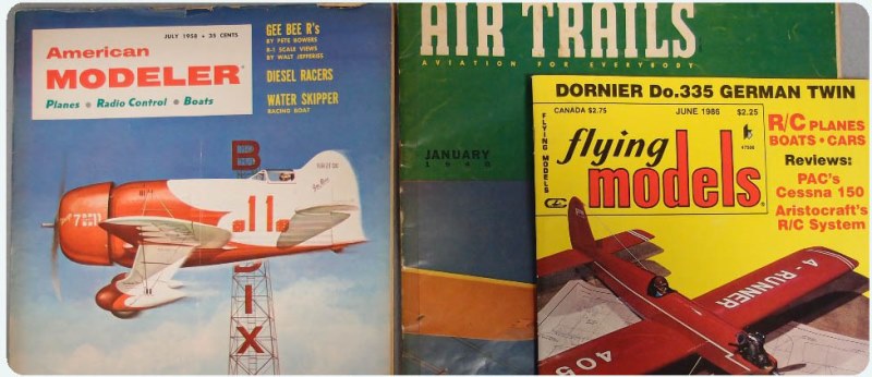 A close-up of various magazine covers like Air Trails and Model Airplane News, all of which are in the National Model Aviation Museum collection.